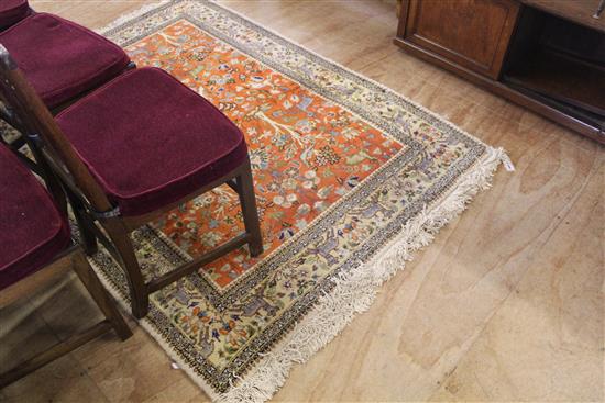 Cream and orange rug